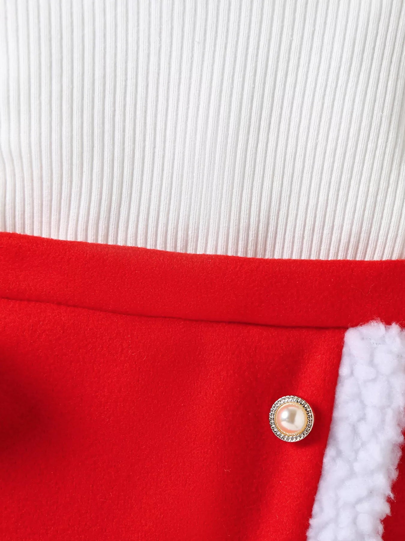 Red baby outfit with white ribbed top and faux fur trim, pearl button detail