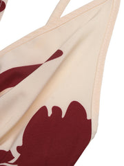 Floral maxi dress with deep V-neck in cream with burgundy abstract floral print.