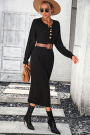 Black textured knit henley midi dress with button detail and long sleeves.