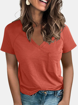 Raglan pocket t-shirt in coral with V-neck and short sleeves.