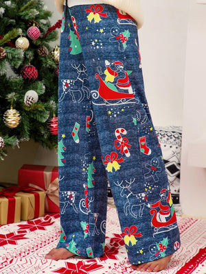 Festive print wide-leg lounge trousers in blue with Santa, reindeer, and Christmas tree patterns.