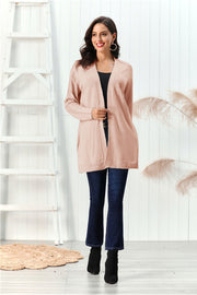 Apricot cable knit open front cardigan with detailed sleeves.
