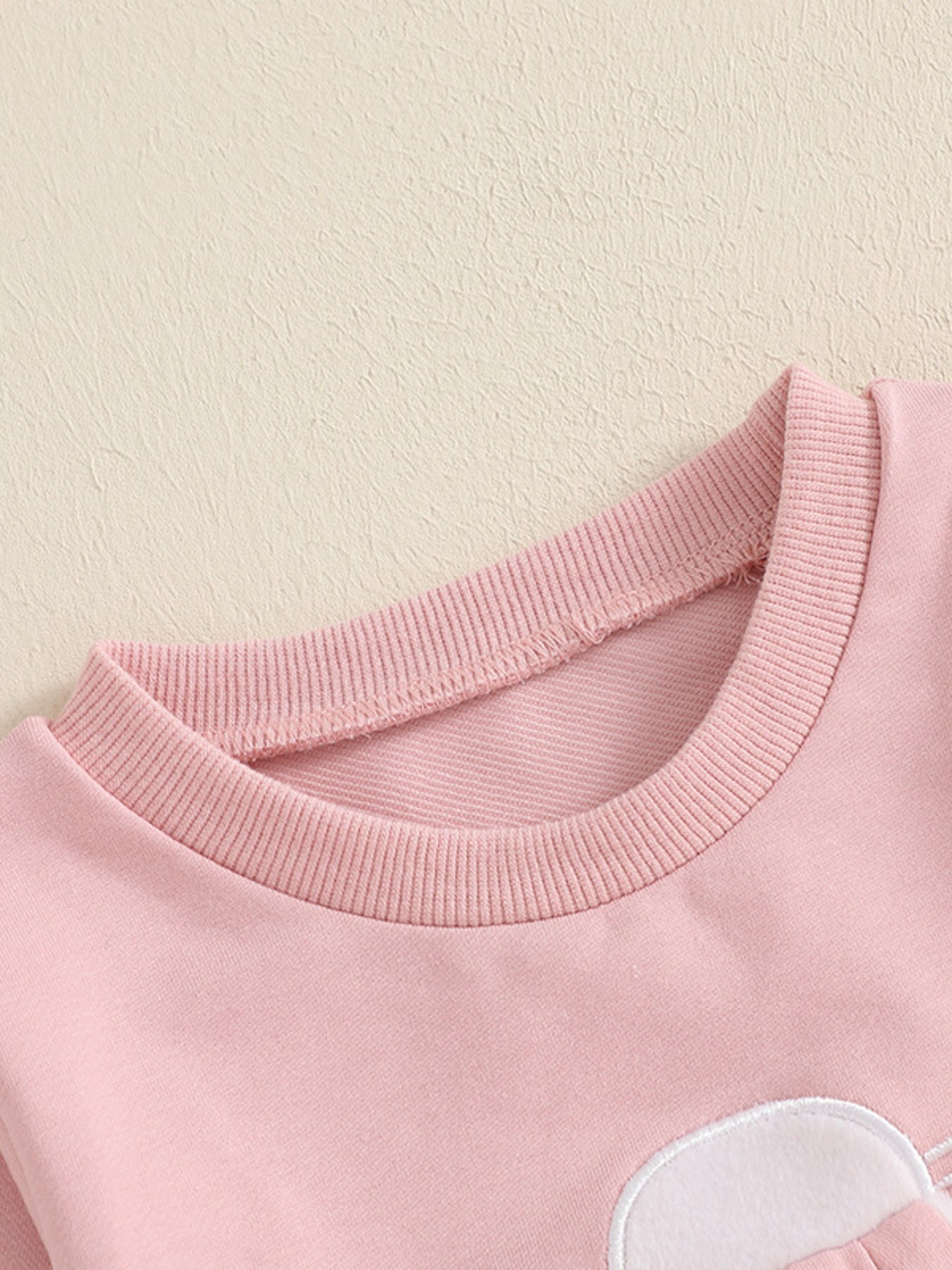 Pink cotton baby outfit with bunny applique detail