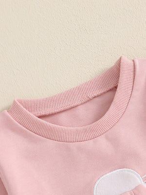 Pink cotton baby outfit with bunny applique detail