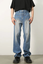 Vintage wash baggy denim jeans in medium blue with a relaxed fit and faded details.