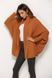 Textured cocoon knit cardigan in caramel with batwing sleeves and open front.