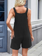 Black ribbed romper overalls with a square neckline and short legs.
