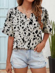 Dalmatian print relaxed notch neck blouse with short sleeves.