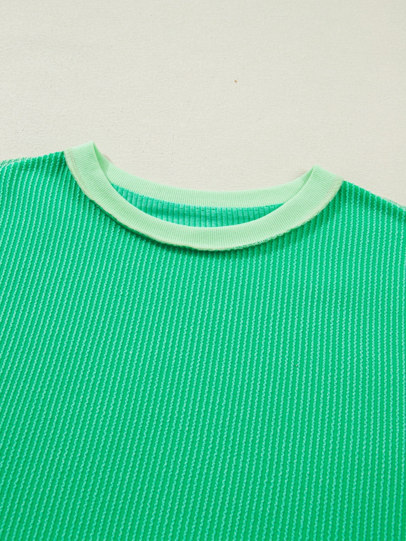 Bright green ribbed t-shirt with contrast neckline detail