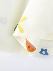 Baby dress with playful fruit and letter print, yellow and blue accents.