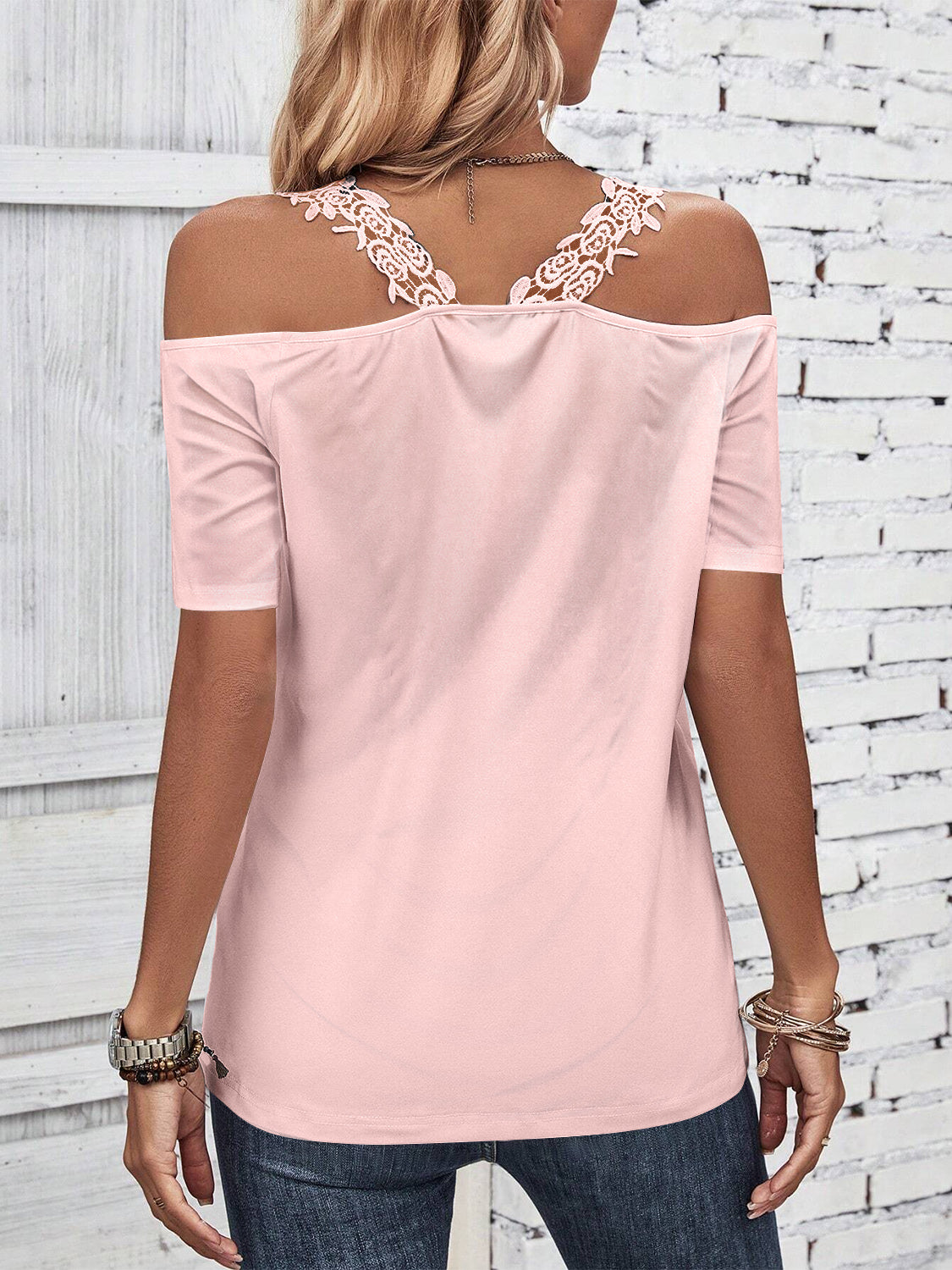 Dusty pink off-the-shoulder top with lace yoke detail and short sleeves.