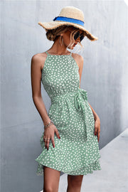 Dotted halter neck mini dress in Gum Leaf green with ruffle hem and tie waist.