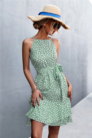 Dotted halter neck mini dress in Gum Leaf green with ruffle hem and tie waist.