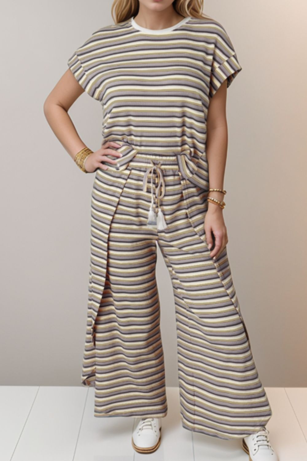 Cotton striped culotte jumpsuit with drawstring waist and side slits.