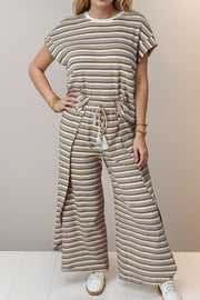 Cotton striped culotte jumpsuit with drawstring waist and side slits.