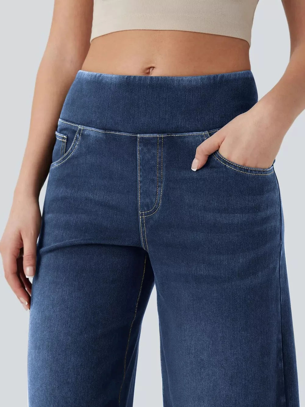 Maternity wide-leg denim jeans in dark blue with a comfortable elastic waistband and front pockets.