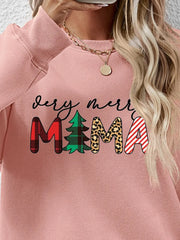 Blush pink long sleeve sweater with "very merry MAMA" graphic in plaid, tree, leopard, and stripe patterns.