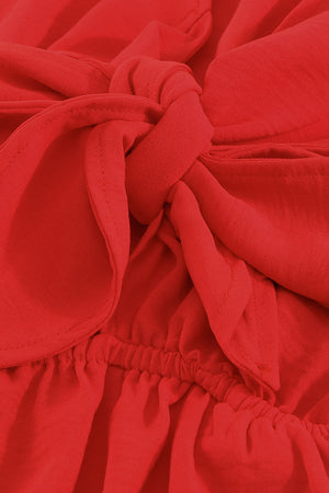 Scarlett playsuit with tie-front detail and elasticated waist.