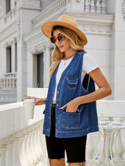 Utility denim vest in medium dark wash with button front and chest pockets.