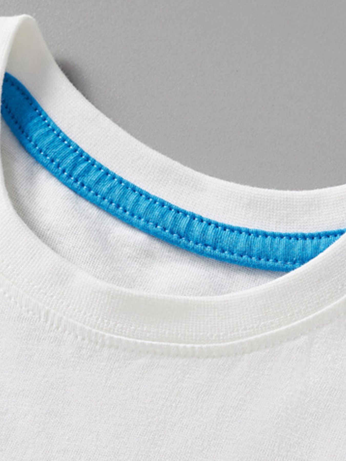White cotton toddler t-shirt with blue stitched neckline detail