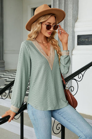 Sage textured V-neck blouse with embroidered neckline and cuffs
