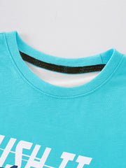 Toddler crew neck t-shirt in turquoise with white graphic text and a dark trim inside the neckline.