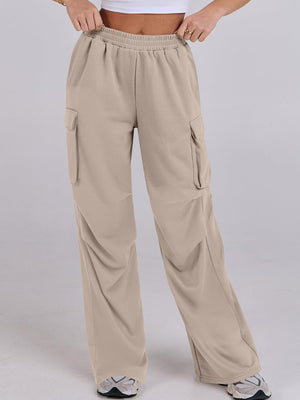 Tan cargo pocket drape wide leg sweatpants with elastic waistband.