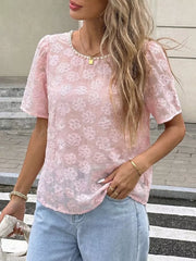 Pink embroidered floral blouse with pearl trim neckline and short puff sleeves.