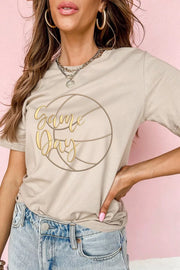Casual beige cotton t-shirt with gold "Game Day" basketball graphic.
