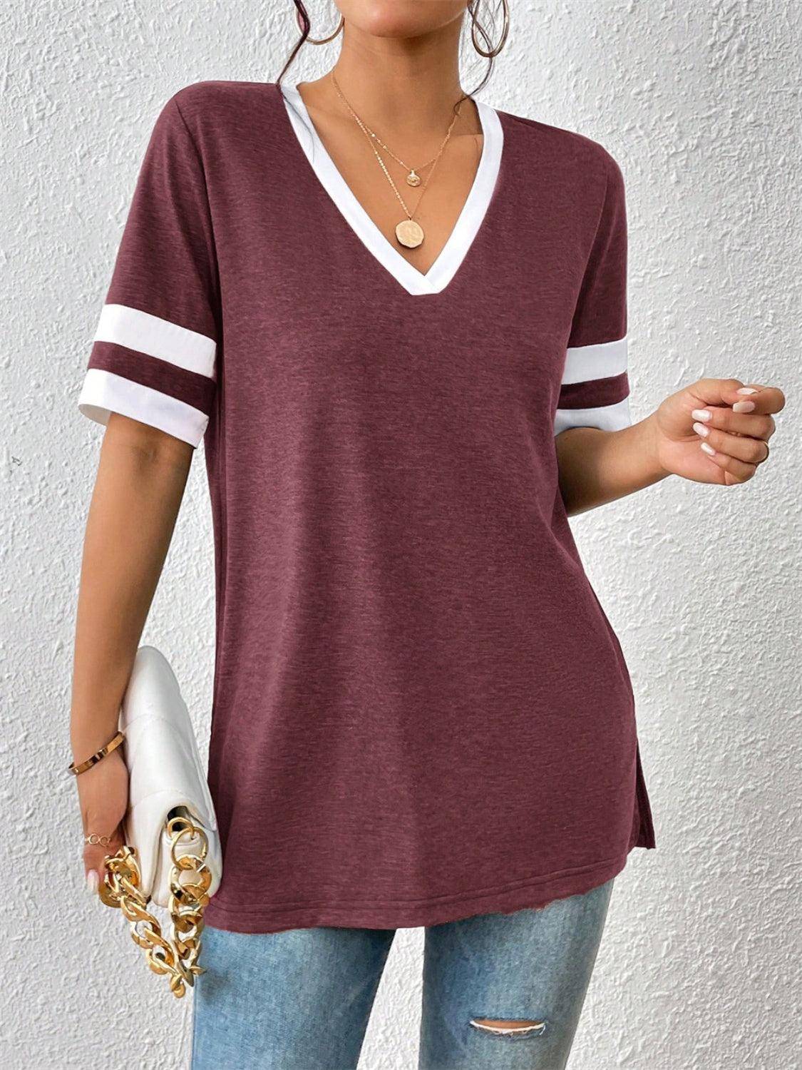 Plum v-neck t-shirt with white contrast trim on neckline and sleeves.
