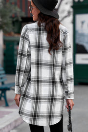 Oversized plaid shirt jacket tunic in black and white, with buttoned cuffs and a curved hem.