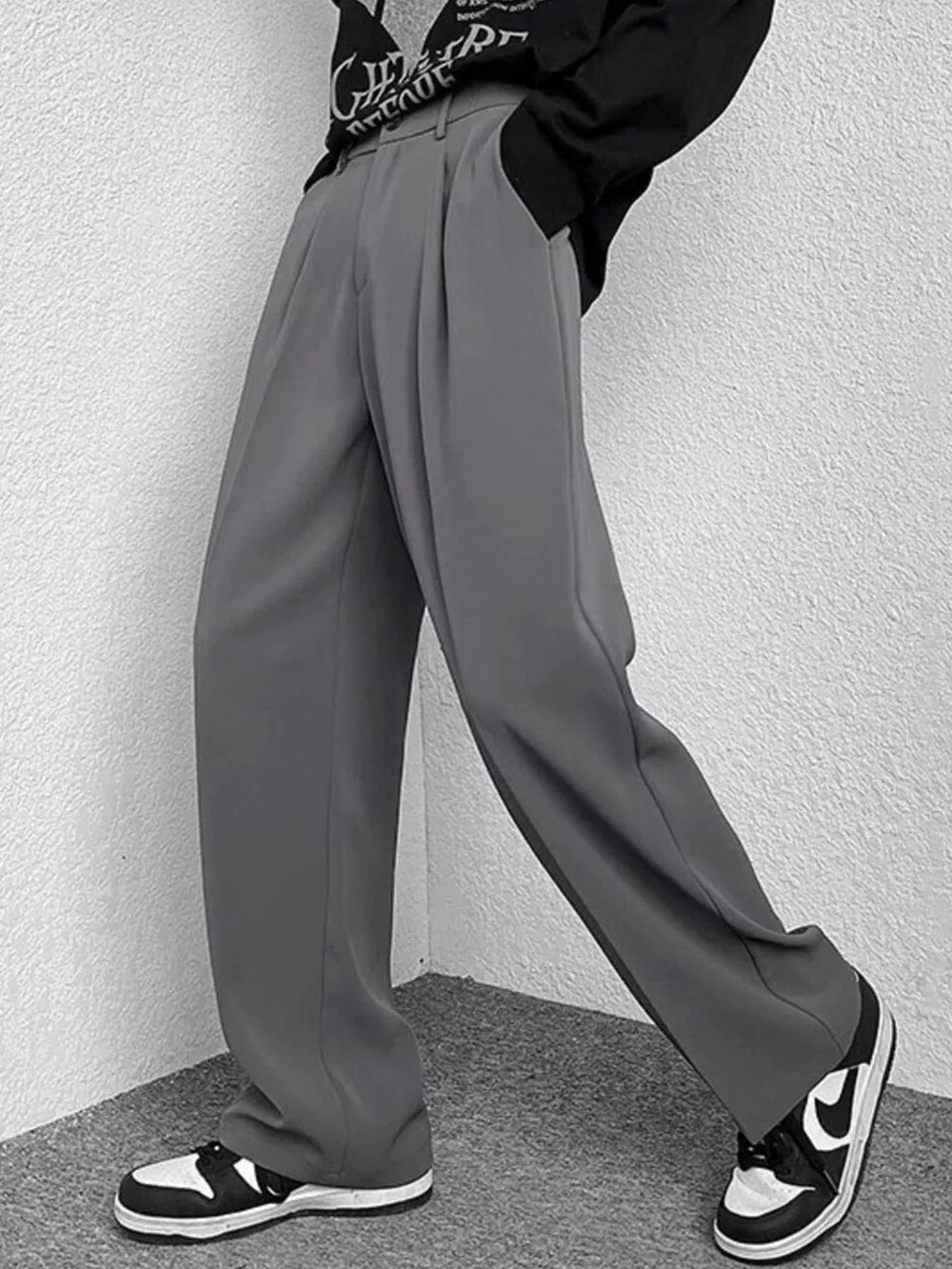 Grey wide-leg casual pants with a relaxed fit and subtle pleats.