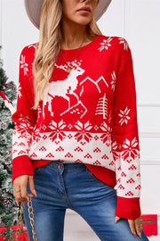 Red acrylic knit sweater with white reindeer, snowflake, and tree fair isle pattern.