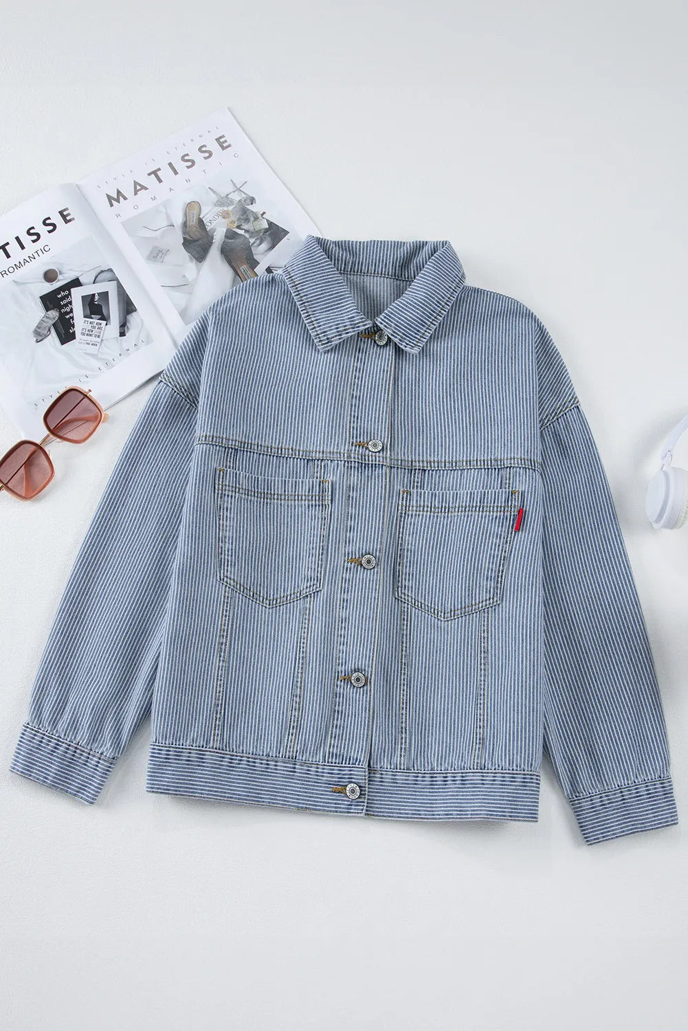 Light pinstripe denim trucker jacket with chest pockets and button front.