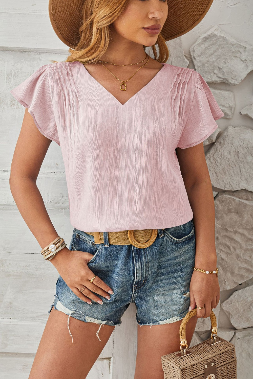 Lilac textured V-neck blouse with pleated flutter sleeves and a casual fit.