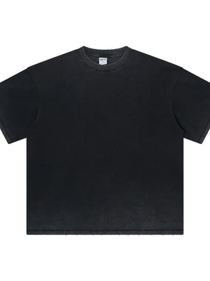 Washed black oversized t-shirt with a crewneck and raw hem details.