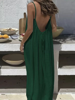 Dark green backless maxi dress with spaghetti straps and a drawstring detail.