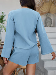 Light blue linen tie-front top and shorts set with bell sleeves.