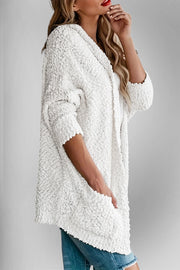 White popcorn knit open cardigan with 3/4 sleeves and pockets.