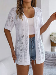 White open-knit pointelle cardigan with short sleeves and a relaxed fit.