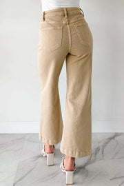 High-waisted cropped wide-leg jeans in tan denim with frayed hem detail.
