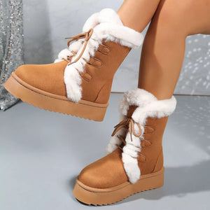 Brown suede lace-up platform boots with white faux fur trim.