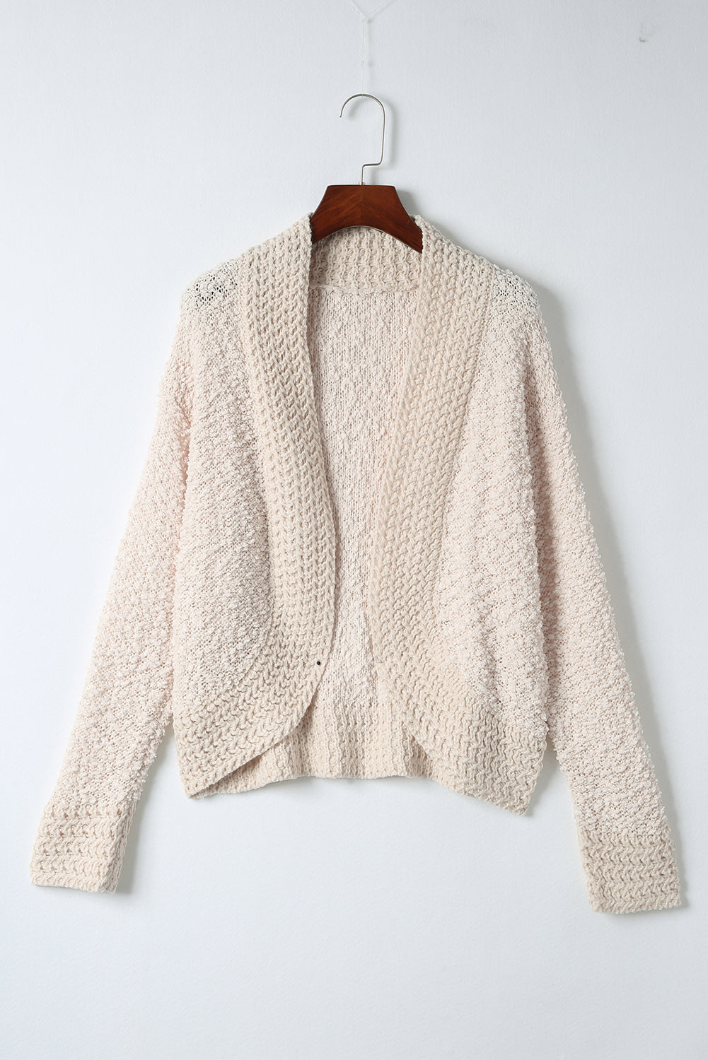Textured bouclé open-front jacket in cream, with a relaxed fit and long sleeves.