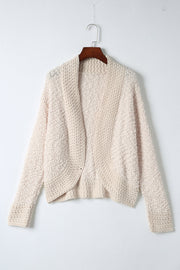 Textured bouclé open-front jacket in cream, with a relaxed fit and long sleeves.