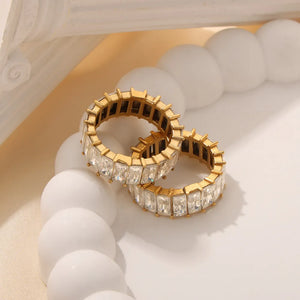 Gold baguette eternity band ring with clear square-cut stones