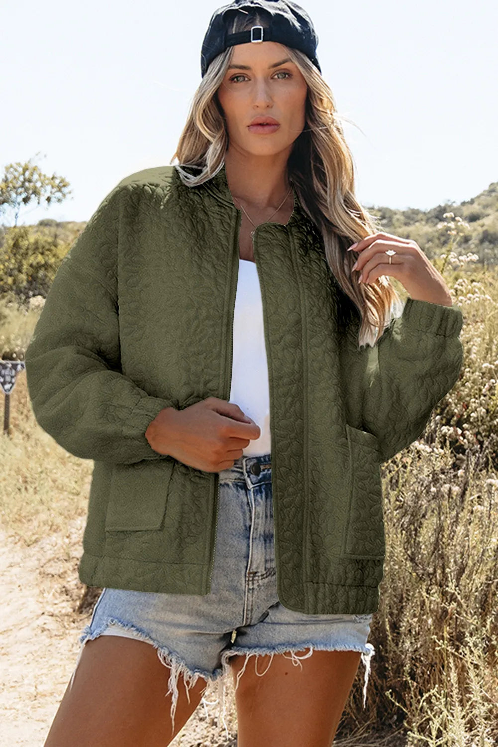Moss quilted bomber jacket with textured pattern and front pockets