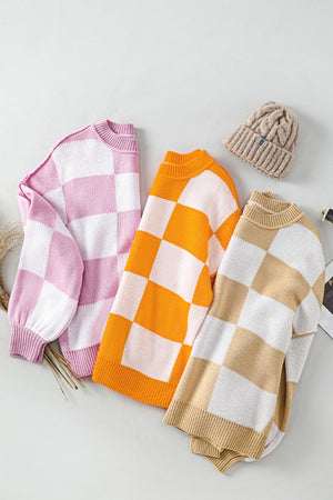 Checkerboard knit crewneck sweater in tan, dusty pink, and tangerine with balloon sleeves.