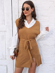 Camel knit vest dress with V-neck, tie waist, and side slit, layered over a white shirt.