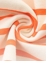 Toddler striped cotton dress in cream and orange with ruffled details.