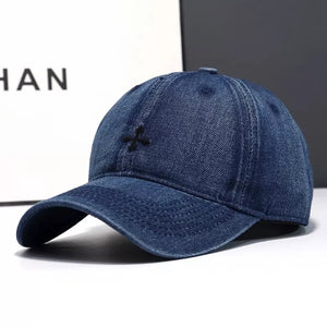 Dark blue denim baseball hat with black embroidered detail